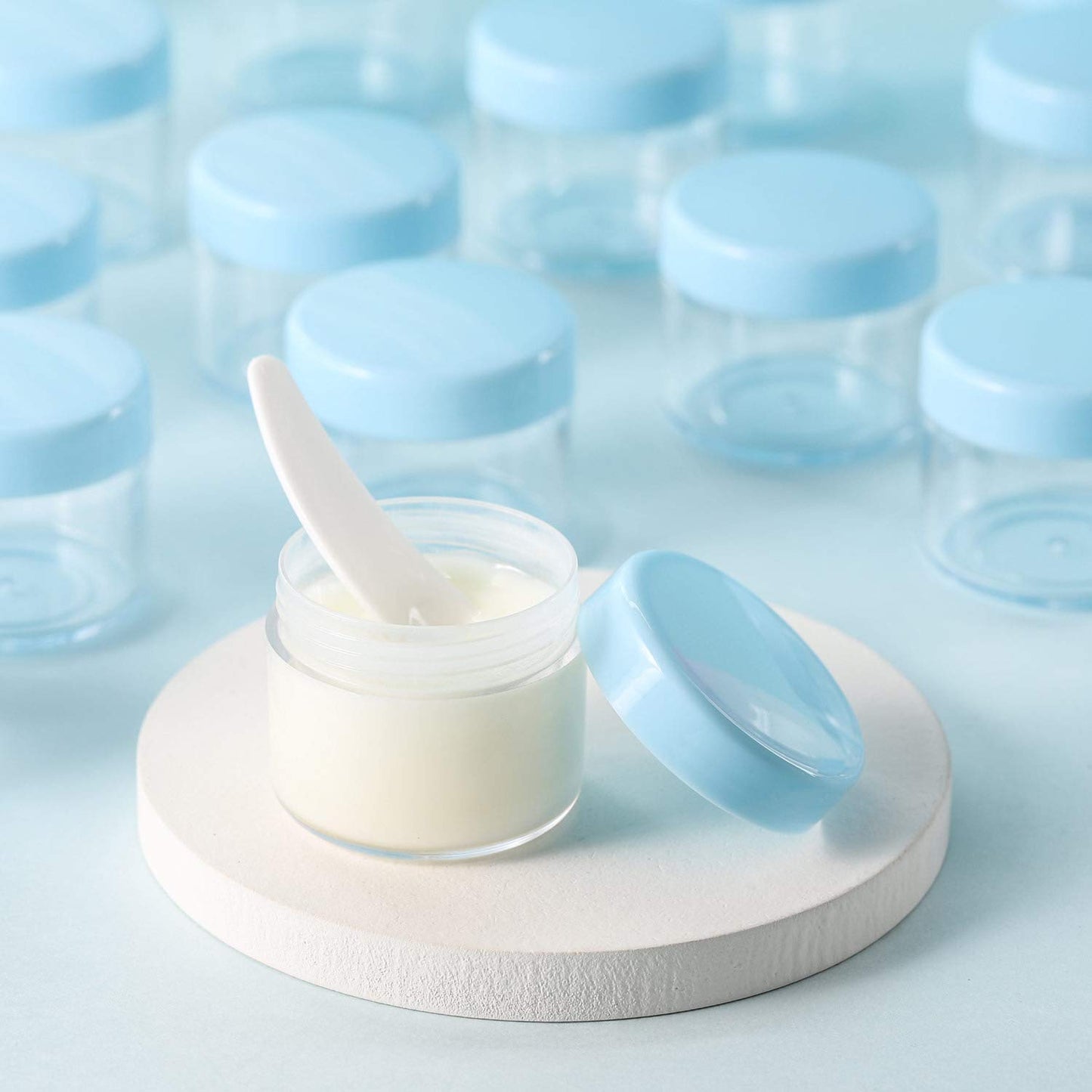 Refillable Cosmetic Sample Jars - 100 Pack 20g (0.7oz) Blue Small Travel Containers with Lids + 10 Mini Makeup Spatulas - BPA Free-Velvo Beauty