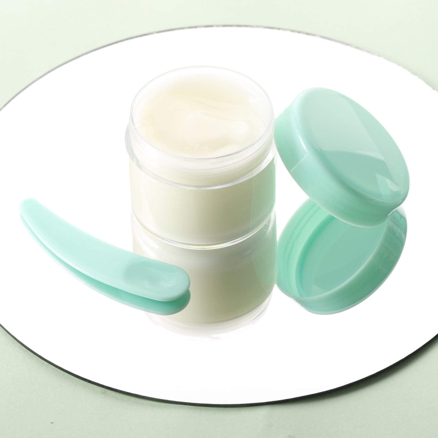 Refillable Cosmetic Sample Jars - 100 Pack 20g (0.7oz) Green Small Travel Containers with Lids + 10 Mini Makeup Spatulas - BPA Free-Velvo Beauty