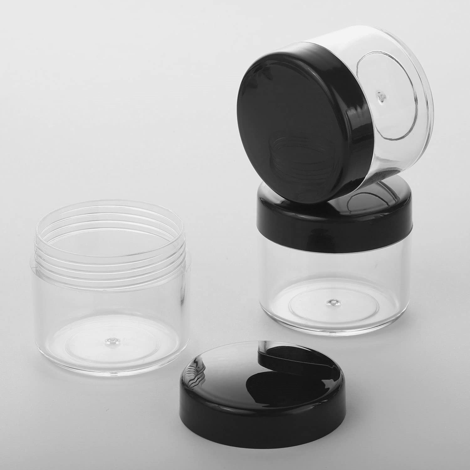 Refillable Cosmetic Sample Jars - 100 Pack 20g (0.7oz) Black Small Travel Containers with Lids + 10 Mini Makeup Spatulas - BPA Free-Velvo Beauty