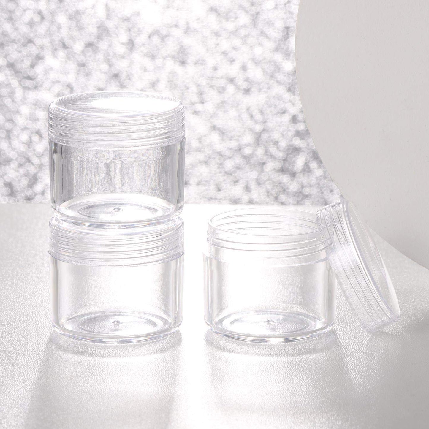 Refillable Cosmetic Sample Jars - 100 Pack 20g (0.7oz) Clear Small Travel Containers with Lids + 10 Mini Makeup Spatulas - BPA Free-Velvo Beauty