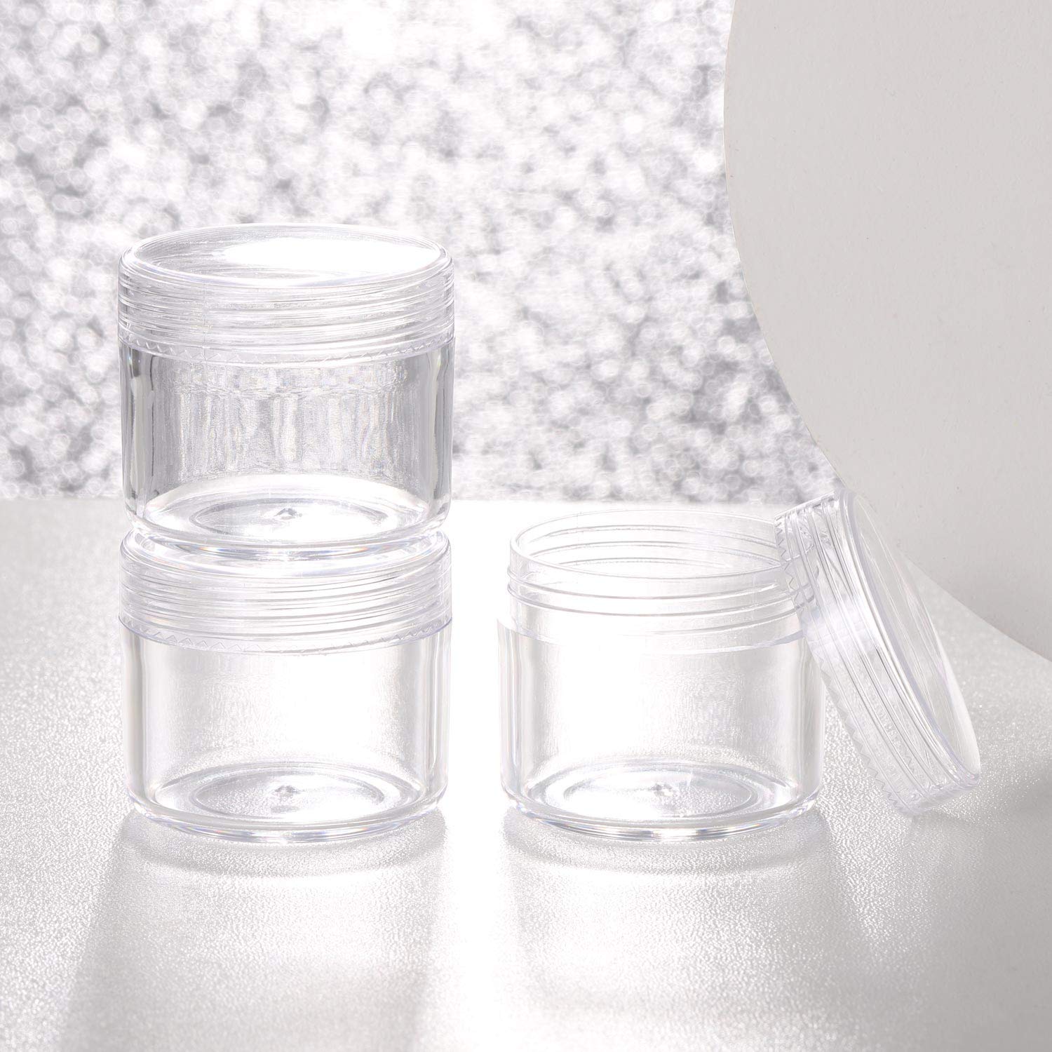 Refillable Cosmetic Sample Jars - 100 Pack 20g (0.7oz) Clear Small Travel Containers with Lids + 10 Mini Makeup Spatulas - BPA Free-Velvo Beauty
