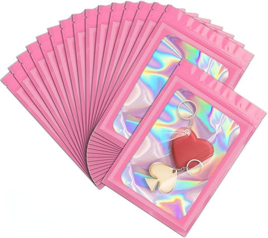 ANZNKU 100 Pack Mylar Bags Reasealable Holographic Bags, Smell Proof Bag Zipper Pouches with Clear Window, Jewelry Candy Sealable Bag for Packaging Sample Party Favor (Pink, 7.1 x 10.2 Inch)-Velvo Beauty