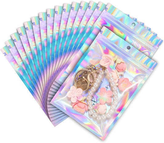 ANZNKU 100 Pack Mylar Bags Reasealable Holographic Bags, Smell Proof Bag Zipper Pouches with Clear Window, Jewelry Candy Sealable Bag for Packaging Sample Party Favor (4.7 x 7.9 Inch)-Velvo Beauty