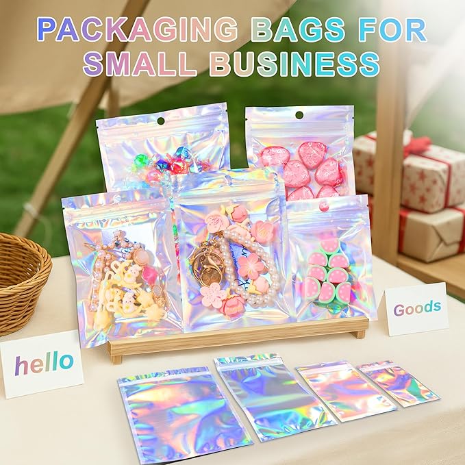 ANZNKU 100 Pack Mylar Bags Reasealable Holographic Bags, Smell Proof Bag Zipper Pouches with Clear Window, Jewelry Candy Sealable Bag for Packaging Sample Party Favor(7.1 x 10.2 Inch)-Velvo Beauty